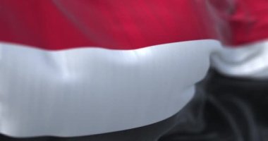 Yemen ulusal bayrağının dalgalanmasına yakından bakın. Yemen Cumhuriyeti, Batı Asya 'da bulunan bir devlettir. Kumaş desenli arka plan. Seçici odaklanma. Yavaş çekimde kusursuz döngü. 3 Boyutlu Hazırlama