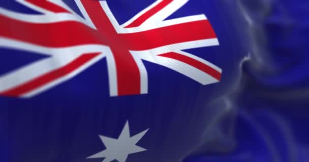 オーストラリア国旗が手を振っのクローズアップビュー オーストラリア連邦はオセアニアに位置する州です 生地の質感の背景 選択的フォーカス スローモーションで無限ループ 3Dレンダリング — ストック動画