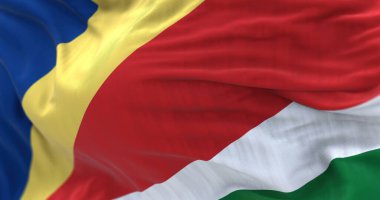 Seyşeller 'in ulusal bayrağının rüzgarda dalgalanmasını yakından izliyoruz. Seyşeller Cumhuriyeti, Hint Okyanusu 'nda yer alan takımadalı bir ülkedir. Seçici odaklanma. 3d illüstrasyon