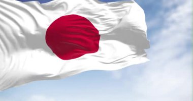 Japonya ulusal bayrağının rüzgarda dalgalanmasını yakından izliyoruz. Japonya Doğu Asya 'da bir ada ülkesidir. Seçici odaklanma. Ağır çekimde sonsuz döngü. 3 Boyutlu Hazırlama