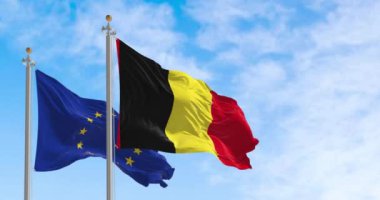 Belçika ve Avrupa Birliği 'nin bayrakları güneşli bir günde rüzgarda sallanıyor. Demokrasi ve politika. Avrupa ülkesi. Yavaş çekimde kusursuz döngü. 3 Boyutlu Hazırlama