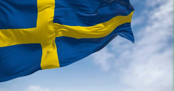 stock image Sweden national flag waving in the wind. The Kingdom of Sweden is a Nordic country in Scandinavia. Selective focus. 3d illustration