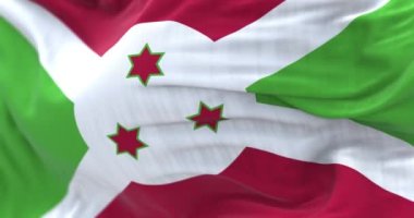 Burundi ulusal bayrağı dalgalanıyor. Burundi Cumhuriyeti, Afrika kıtasında bulunan bir ülkedir. Kumaş desenli arka plan. Seçici odaklanma. Yavaş çekimde kusursuz döngü. Gerçekçi 3B canlandırma