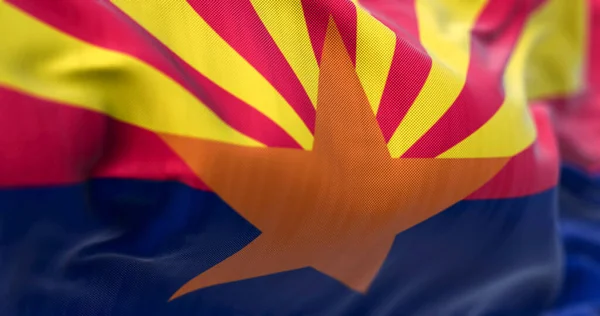 Close-up view of Arizona state flag waving. The center star signifies copper production. Rippled Fabric. Textured background. Selective focus. Realistic 3d illustration
