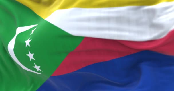 国旗が手を振っている コモロ連合 Union Comoros インド洋の群島国家である フリップルテクスチャ生地 選択的フォーカス 現実的な3Dレンダリング スローモーションループ — ストック動画