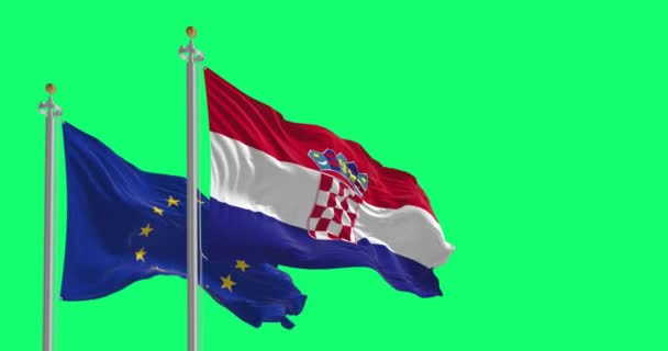 克罗地亚和欧洲联盟的旗帜在绿色背景下相互飘扬 彼此隔绝 现实的3D渲染 绿色屏幕垫和色键 慢动作回路 — 图库视频影像