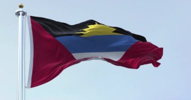 Antigua and Barbuda national flag waving on a clear day. Antigua and Barbuda is an island state of Central America. Rippled fabric. Realistic 3D render. Slow motion loop