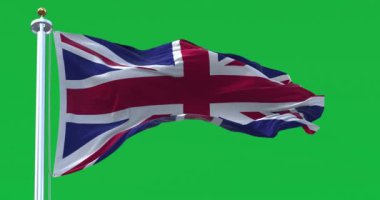 United Kingdom flag waving isolated on a green background. Union Jack. Blue field with red, white crosses of patron saints. Rippled fabric. 3D render. Slow motion loop. Green screen matte. Chroma key