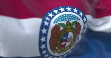 The US state flag of Missouri waving. Missouri is a state in the Midwestern region of the United States. Close-up. Selective focus. Rippled fabric. Realistic 3D render animation. Slow motion loop