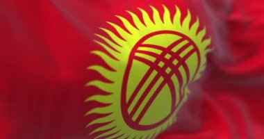 Perspective view of Kyrgyzstan flag fluttering in the wind. Red flag with stylized sun in the center. Fluttering fabric. Selective focus. Realistic 3d render animation. Close-up. Slow motion loop