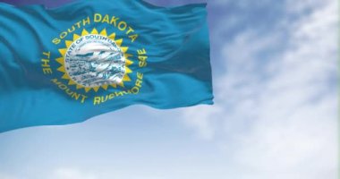 South Dakota flag waving in the wind on a sunny day. Federated American state located in the high plains of the Midwest. Fabric fluttering and flapping. Realistic 3D render animation. Slow motion loop
