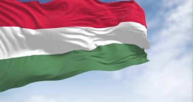 The national flag of Hungary fluttering in the wind on a clear day. Horizontal striped flag of red, white and green. Fluttering fabric. Realistic 3D render animation. Slow motion loop