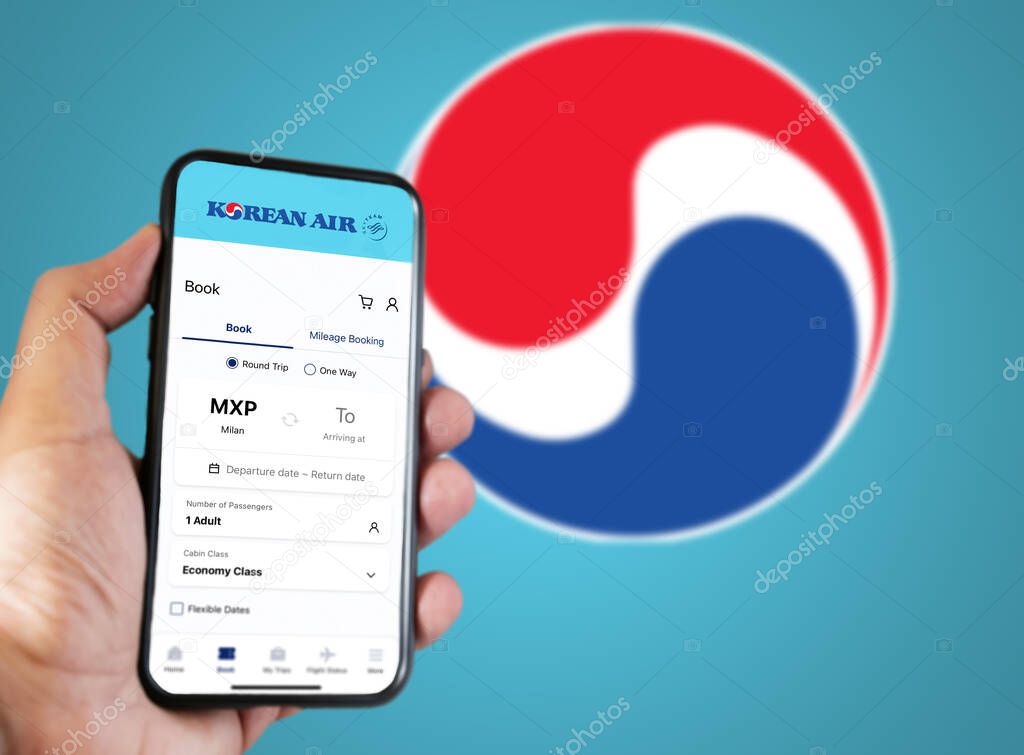 Seoul, KR, Jan 2023 Hand holding a phone with Korean Airlines flight