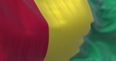 Detail of Guinea National flag waving. Republic of Guinea is a West African state. Fluttering textile. Selective focus. 3d render animation. Slow motion loop. Close-up