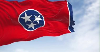 Tennessee state flag waving on a clear day. Three white stars in a blue circle on a red background, white stripe and a blue band on the right. Fluttering textile. 3d render animation. Slow motion loop