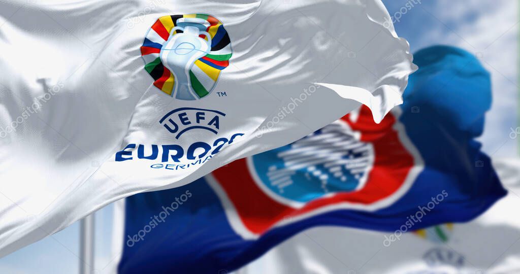 Berlin, DE, Feb 2023: The flags of Euro 2024 and UEFA fluttering in the wind. The 17th edition of the 2024 UEFA European Football Championship will be hosted by Germany. Realistic 3d illustration