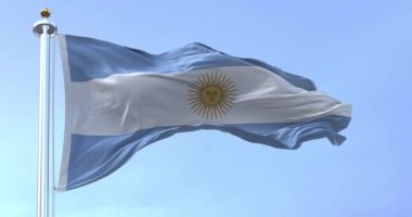Argentine flag fluttering on a sunny day. The Argentine flag has three equal blue and white horizontal bands with the Sun of May in the center. Fabric fluttering. 3D render animation. Slow motion loop