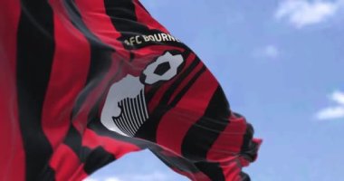Bournemouth, İngiltere, Ekim 2022: AFC Bournemouth bayrağı dalgalanıyor. AFC Bournemouth bir İngiliz futbol kulübüdür. Seçici odaklanma. 3D canlandırma canlandırması. Yavaş çekim döngüsü. Yakın plan.