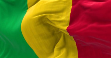 Detail of the Mali national flag waving in the wind.Vertical tricolor, Pan-African colors, green, yellow, and red. 3d illustration render. Selective focus. Close-up. Textured background
