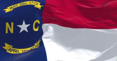 North Carolina state flag waving. North Carolina is a state in the Southeastern region of the United States. Rippled fabric. 3d illustration render. Slow motion loop. Close-up. Textured background