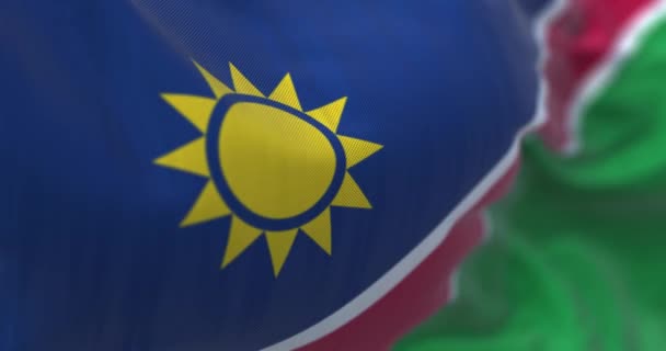 Vista Perto Bandeira Nacional Namíbia Acenando Listras Azuis Sol Amarelo — Vídeo de Stock
