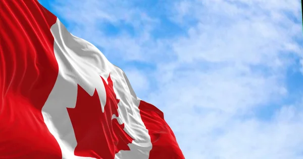 晴れた日にはカナダ国旗が風になびく 中央の白い四角形と11点の赤の様式化されたカエデの葉 選択的フォーカス 3Dイラストレンダリング リプルド繊維 — ストック写真