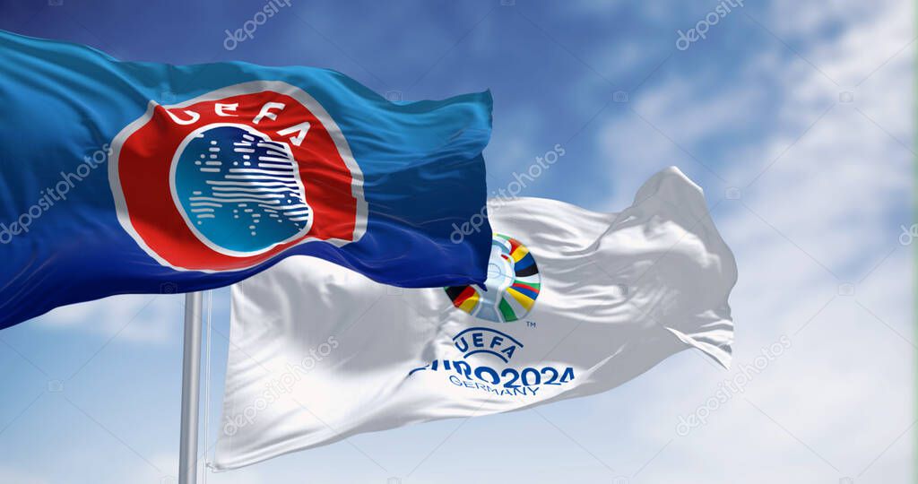 Berlin, DE, Feb 2023: Flags of Euro 2024 and UEFA fluttering in the wind. The 2024 UEFA European Football Championship will be hosted by Germany. Illustrative editorial 3d illustration render