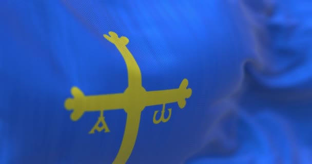 アストゥリアスの旗を振って スペイン北部の自治体 黄金の勝利の十字架と青のホイスト側にシフトしました 3Dレンダリングアニメーション スローモーション シームレスなループだ 選択的フォーカス — ストック動画