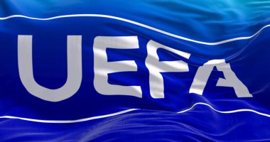 Nyon, CH, Nisan 2023: UEFA bayrağının rüzgarda dalgalanması. UEFA, Avrupa 'da profesyonel futbolu yöneten bir dernektir. Resimli 3d illüstrasyon oluşturucu