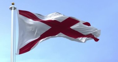 Alabama eyalet bayrağı açık bir günde dalgalanır. Aziz Andrews beyaz bir arka planda kesişiyor. 3D canlandırma canlandırması. Ağır çekim. Kusursuz döngü. Seçici odaklanma. Yakın plan. Desenli dalgalı arkaplan