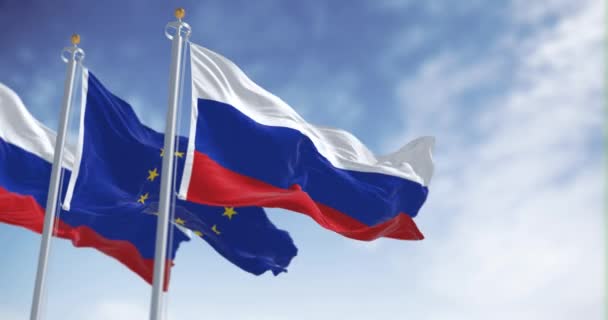 ロシアと欧州連合の旗は晴れた日に振っている シームレスな3Dレンダリングアニメーション スローモーションループ 選択的フォーカス なびく織物 — ストック動画