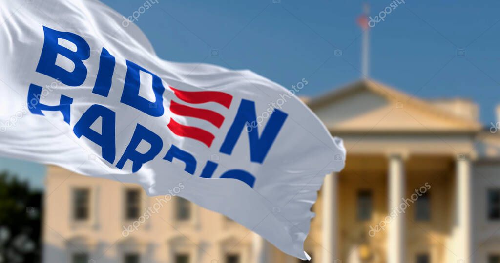 Washington D.C., US, april 2023: Flag with Biden Harris 2024 presidential election campaign logo waving in front a blurred White House. Illustrative editorial 3d illustration render