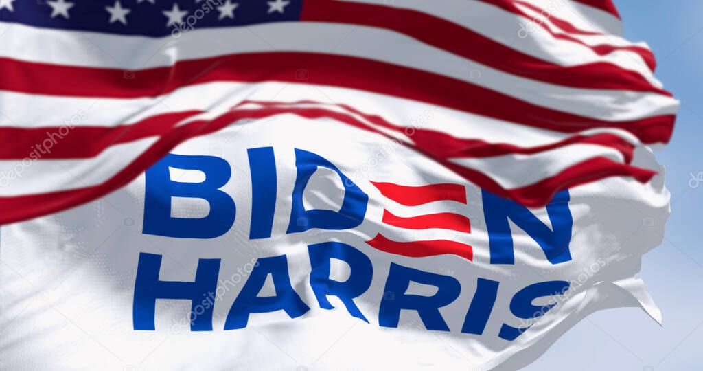 Washington D.C., US, apr. 2023: Biden Harris 2024 presidential election campaign flag waving under national Us flag. Illustrative editorial 3d illustration render. 2024 US presidential election