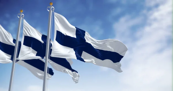 Tres Banderas Nacionales Finlandia Ondeando Viento Día Despejado Cruz Azul —  Fotos de Stock