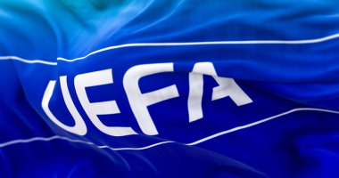 Nyon, CH, Nisan 2023: UEFA bayrağının rüzgarda dalgalanması. UEFA, Avrupa 'da profesyonel futbolu yöneten bir dernektir. Resimli 3d illüstrasyon oluşturucu