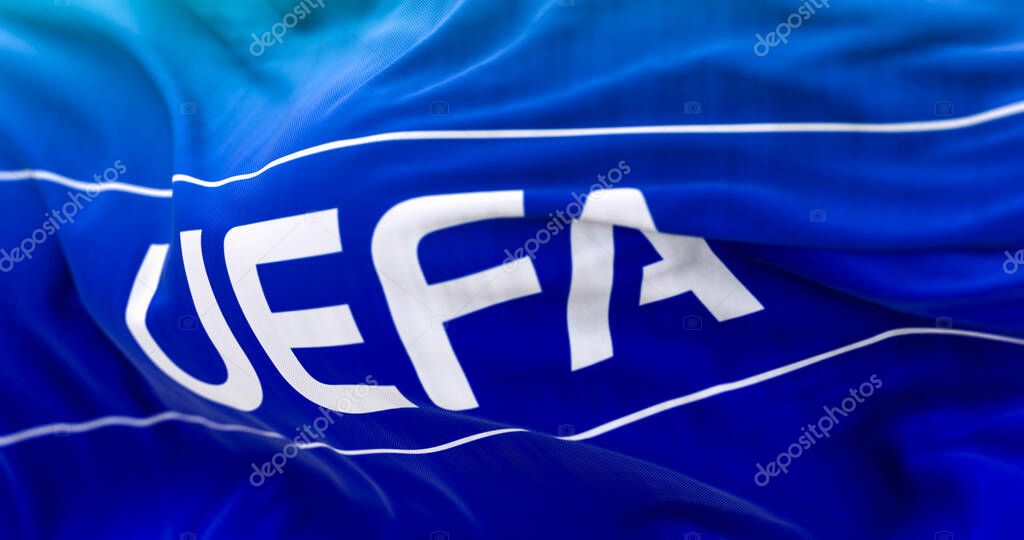 Nyon, CH, April 2023: Close-up of UEFA flag waving in the wind. UEFA is the association that manages professional football in Europe. Illustrative editorial 3d illustration render