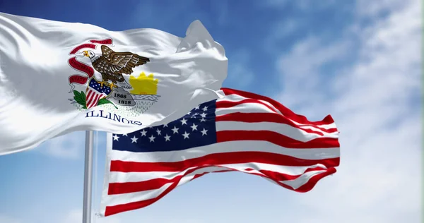 stock image The Illinois state flag waving along with the national flag of the United States of America on a clear day. 3D illustration render. Fluttering fabric