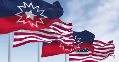 Juneteenth ve Birleşik Devletler bayrakları dalgalanıyor. Juneteenth, Afro-Amerikan kurtuluşunu kutlayan ABD bayramı. 3D canlandırma canlandırması. Yavaş çekim döngüsü. Seçici odaklanma. Kanat çırpan kumaş. Yakın plan.