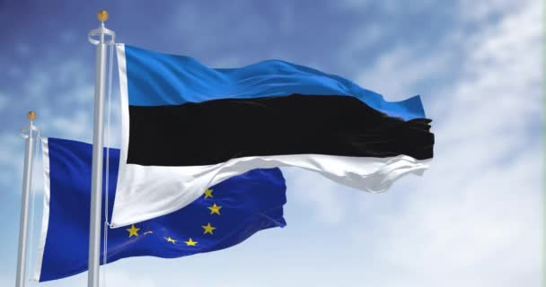 エストニアと欧州連合の旗が晴れた日に振っている シームレスな3Dレンダリングアニメーション スローモーションループ 選択的フォーカス フラッタリング生地 — ストック動画