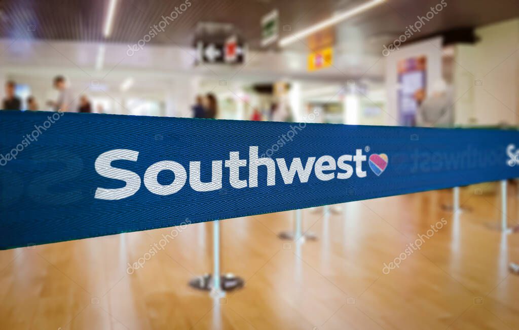 Atlanta, US Jan 2023: Blue barrier tape with the Southwest Airlines logo inside an airport. Southwest the largest low-cost carrier in the world. Travel and airport security. Illustrative editorial