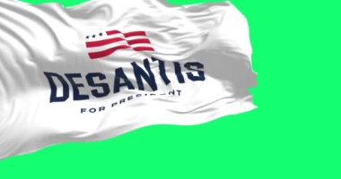 Tallahassee, ABD, 28 Nisan 2023: Ron DeSantis 2024 Cumhuriyetçi başkanlık seçim kampanyası bayrağı dalgalanması. Kusursuz 3D canlandırma animasyonu. Yeşil ekran. Krom anahtar. Yavaş çekim döngüsü. 4 bin. Seçici odak