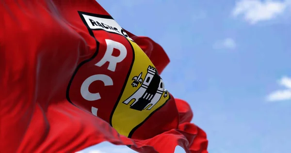 Stock image Lens, FR, Sept 3 2023: RC Lens flag waving in the wind on a clear day. French professional football club. ILlustrative editorial 3d illustration render. Selective focus. Fluttering fabric