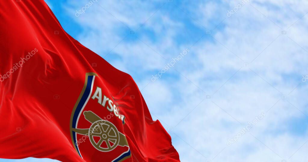 London, UK, august 20 2023: Arsenal Football Club flag waving on a clear day. English professional football club. Illustrative editorial 3d illustration render. Rippled Fabric. Selective focus