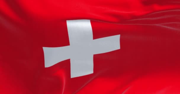 Närbild Schweiz Nationella Flagga Viftar Vinden Röd Bakgrund Med Ett — Stockvideo