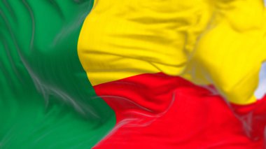 Benin Ulusal Bayrağı 'nın yakın çekimi. Uçan tarafta iki yatay sarı ve kırmızı şerit ve kaldırmada da yeşil dikey şerit. 3D illüstrasyon canlandırıcı. Kanat çırpan kumaş. Seçici odak