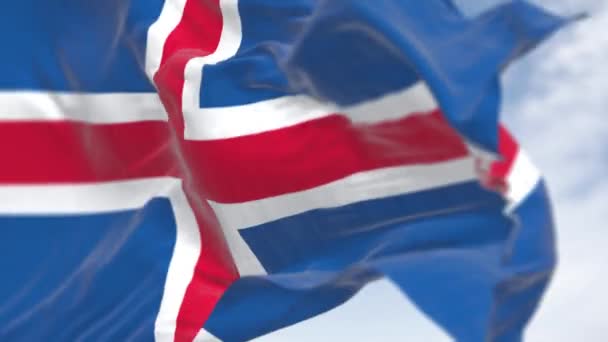 アイスランド国旗の閉鎖 白い十字架と白い十字架の中の赤い十字架を持つ青 シームレス3Dレンダリングアニメーション スローモーションループ 選択的な焦点 4Kについて ストック動画