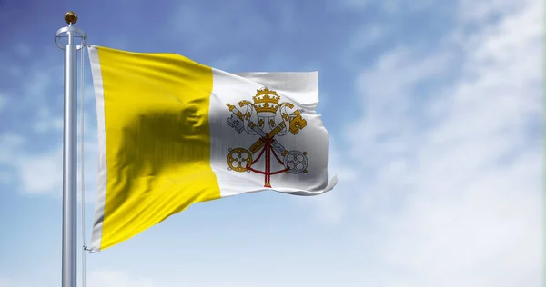 Flag of Vatican City waving in the wind on a clear day. Vertical bicolour of gold and white with the coat of arms centred on the white portion. 3d illustration render. Fluttering fabric