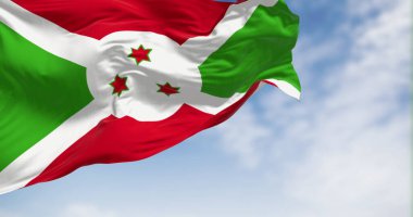 Burundi 'nin ulusal bayrağı açık havada dalgalanıyor. Kırmızı ve yeşil bölümlere bölünen beyaz köşegen, ortada üç yeşil yıldız. 3D illüstrasyon canlandırıcı. Kanat çırpan kumaş. Seçici odak