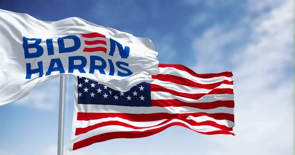 stock image Washington D.C., US, June 20 2023: Biden Harris 2024 presidential campaign flag waving with the american flag. Illustrative editorial 3d illustration render. 2024 US presidential election