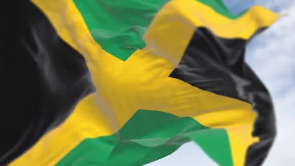 Close Jamaica National Flag Waving Clear Day Gold Saltire Dividing — Stock Video